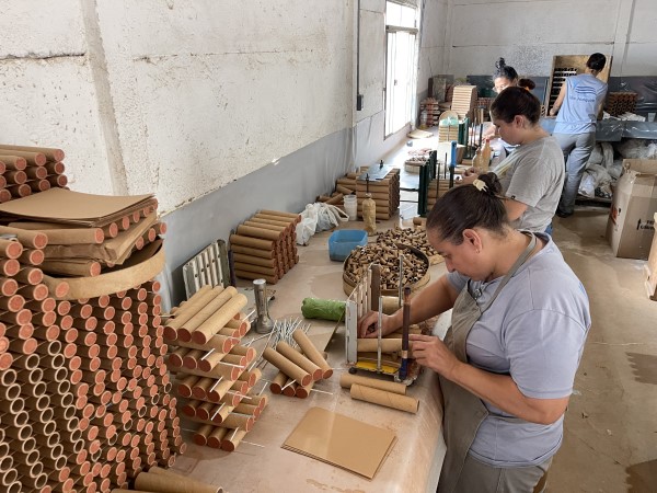 Image of people working on products in a factory